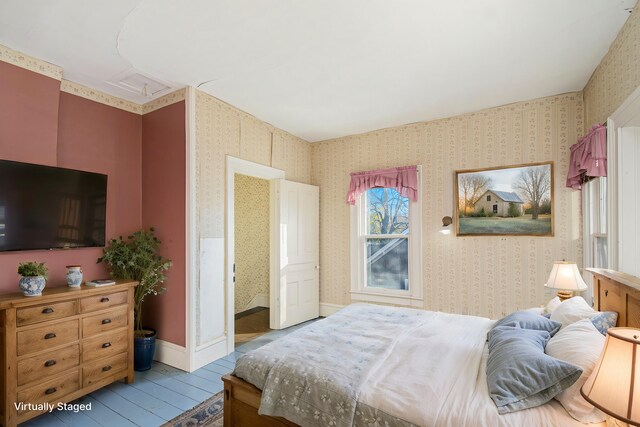 bedroom with light wood-type flooring