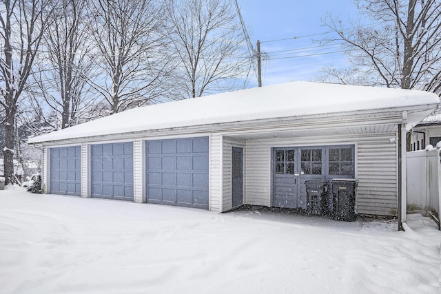 view of snow covered garage