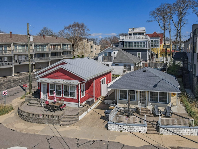 rear view of house featuring a balcony