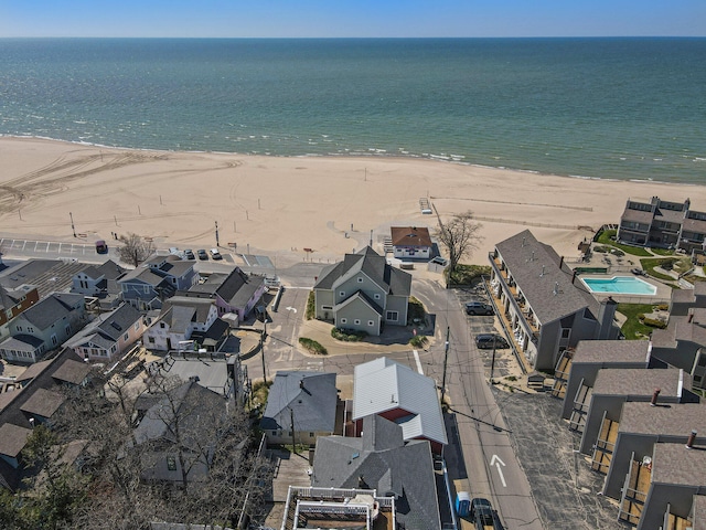 aerial view featuring a water view and a view of the beach