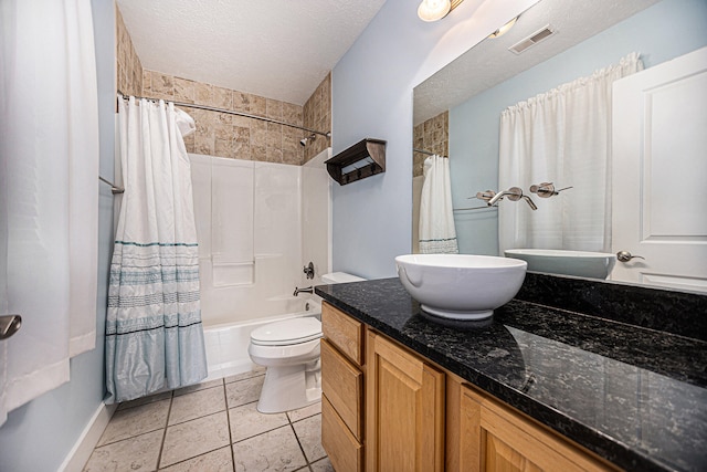 full bathroom featuring a textured ceiling, toilet, shower / bath combo, vanity, and tile patterned flooring