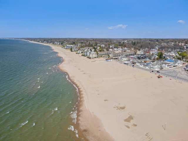 aerial view with a water view and a view of the beach