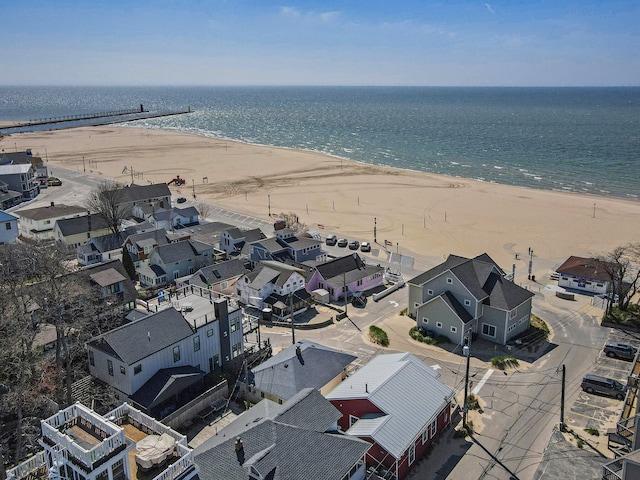 bird's eye view with a water view and a view of the beach