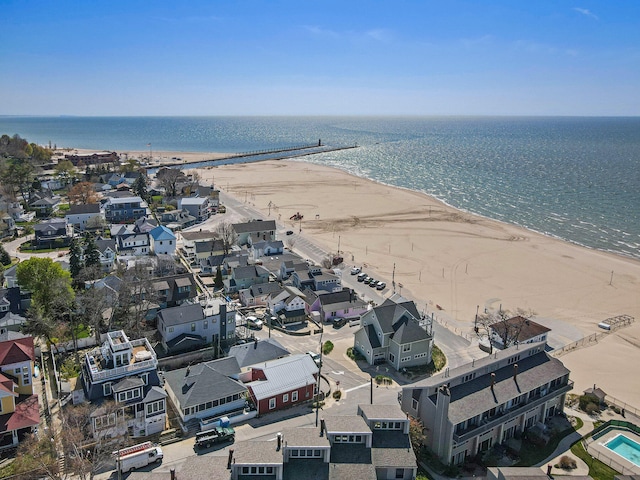 aerial view featuring a water view and a beach view