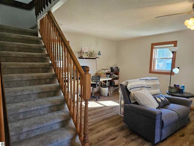 interior space with hardwood / wood-style floors and a textured ceiling