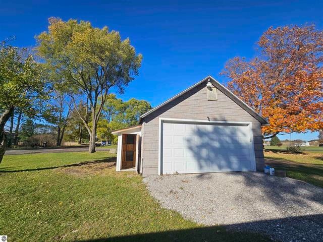 garage featuring a yard