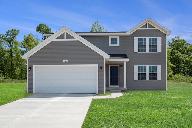 view of front of house featuring a front yard and a garage