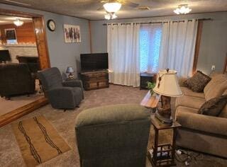 carpeted living room featuring ceiling fan