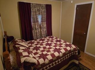 bedroom featuring hardwood / wood-style floors