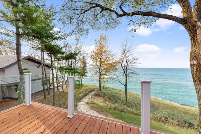 wooden deck featuring a water view