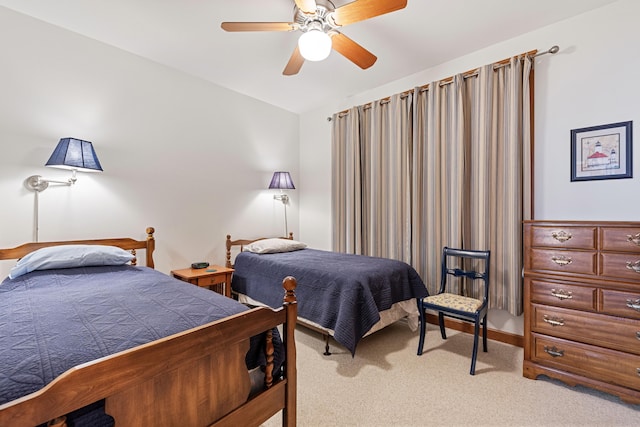 bedroom featuring vaulted ceiling, light carpet, and ceiling fan