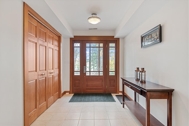 foyer featuring light tile patterned floors