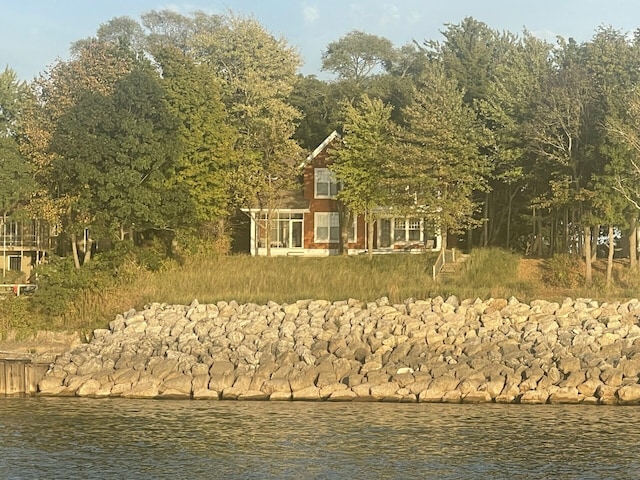 exterior space with a water view