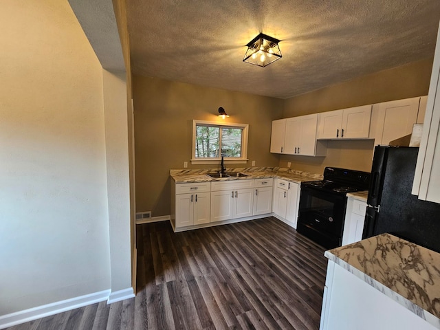 kitchen with white cabinets, a textured ceiling, black appliances, dark wood-type flooring, and sink