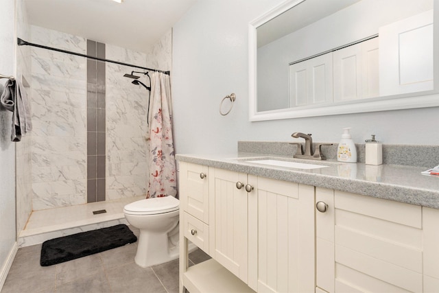 bathroom featuring vanity, toilet, a shower with shower curtain, and tile patterned flooring