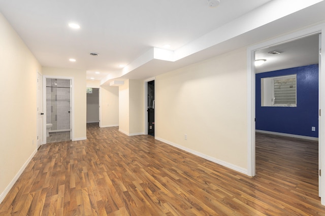 basement featuring dark wood-type flooring