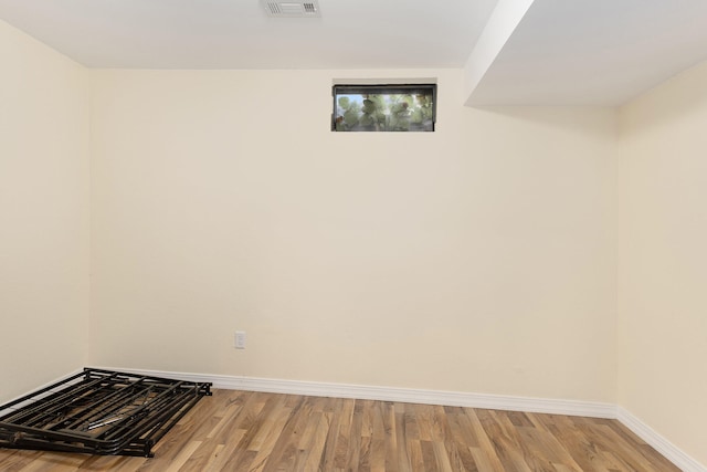 basement featuring light wood-type flooring