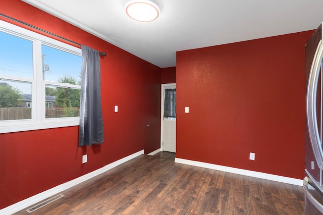 empty room featuring dark hardwood / wood-style floors