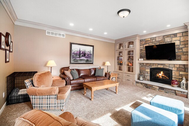 living room featuring ornamental molding, carpet floors, and a fireplace