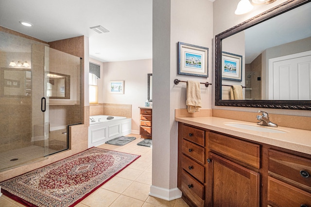 bathroom with vanity, shower with separate bathtub, and tile patterned floors