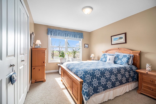 carpeted bedroom featuring a closet