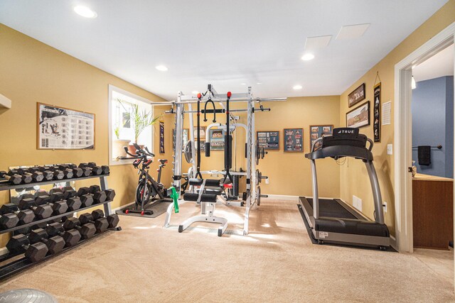 exercise room featuring light colored carpet