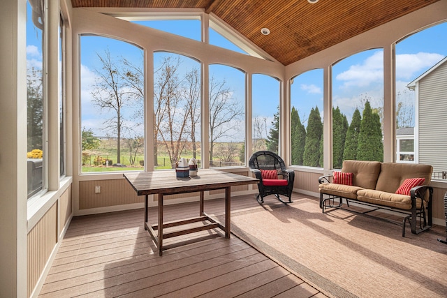 sunroom / solarium with a wealth of natural light, wooden ceiling, and vaulted ceiling