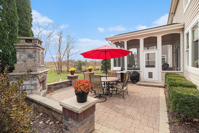 view of patio featuring a sunroom