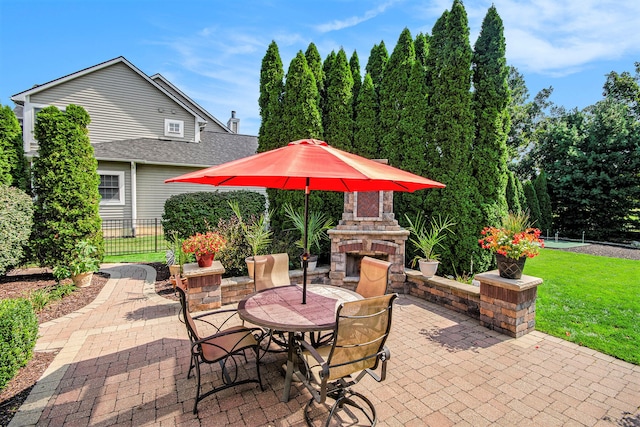 view of patio / terrace with exterior fireplace