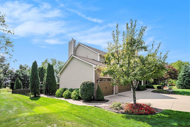 view of side of home with a lawn