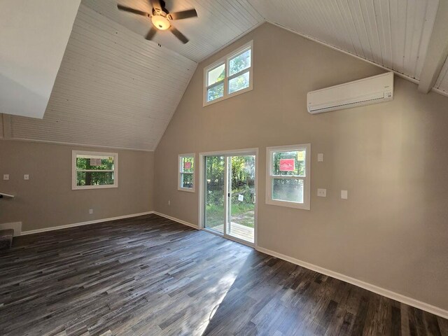 unfurnished living room featuring ceiling fan, lofted ceiling, a wall mounted AC, and dark hardwood / wood-style flooring