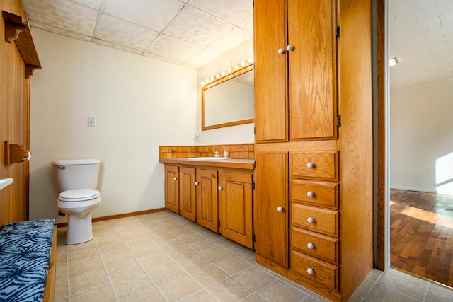 bathroom featuring vanity, toilet, and tile patterned floors