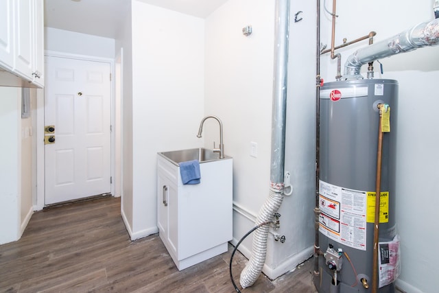 utility room with sink and water heater