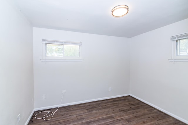 spare room featuring dark hardwood / wood-style floors