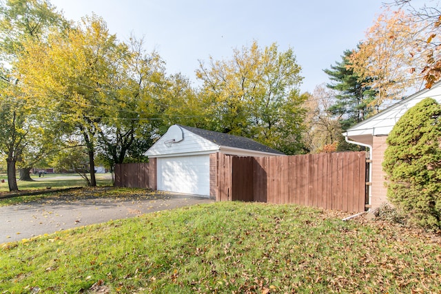 garage featuring a yard