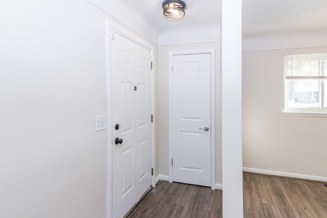 entryway featuring a textured ceiling and hardwood / wood-style floors