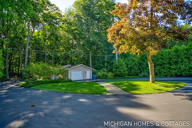 exterior space with a yard and an outbuilding