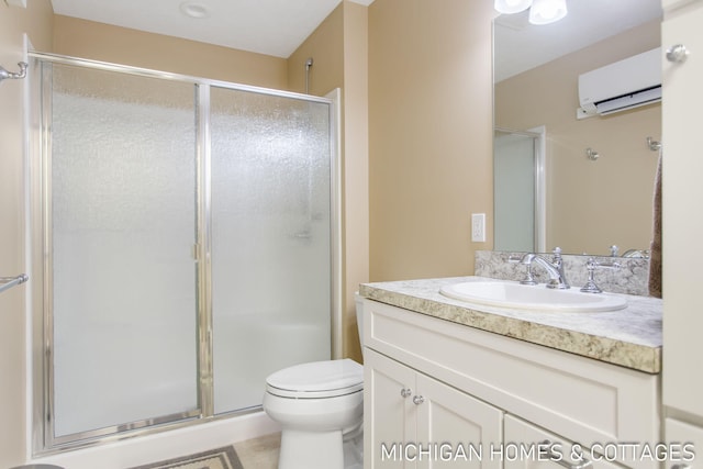 bathroom featuring an AC wall unit, vanity, toilet, and walk in shower