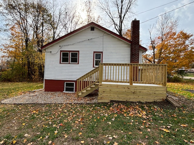 back of property featuring a deck