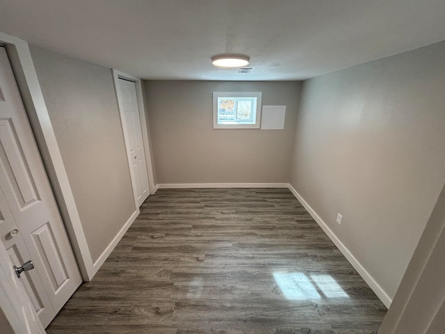 basement featuring dark wood-type flooring