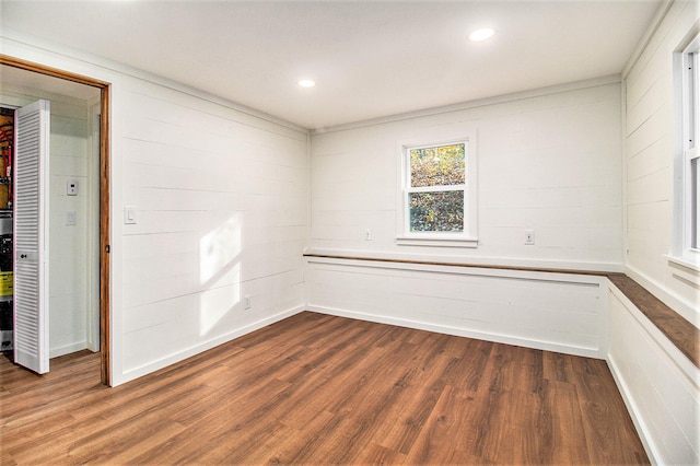 unfurnished room featuring dark hardwood / wood-style floors