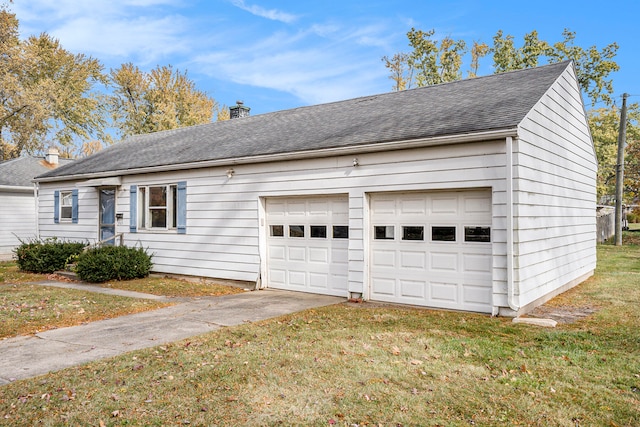 exterior space with a front yard and a garage