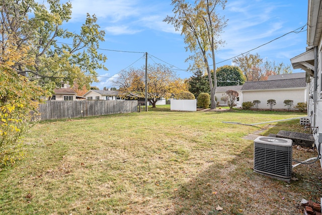 view of yard featuring central air condition unit