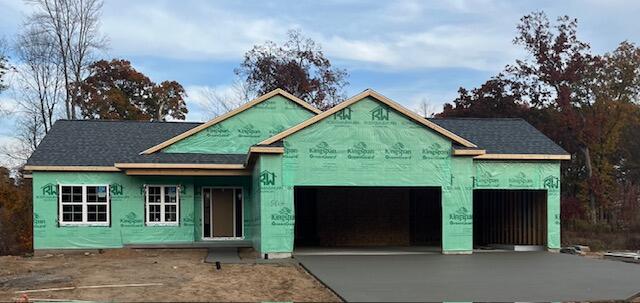 property in mid-construction featuring a garage