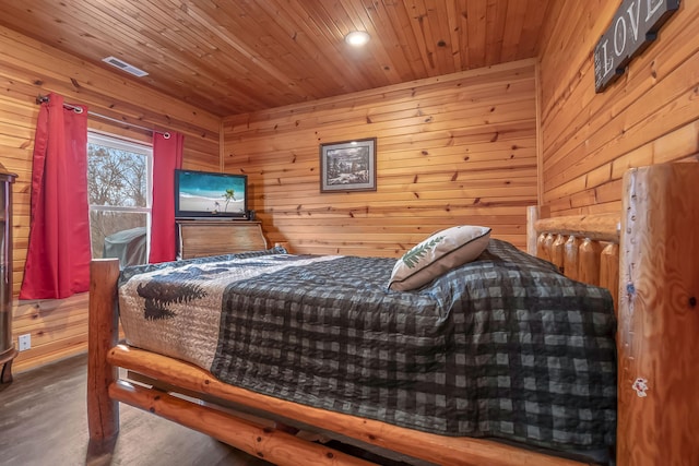 bedroom featuring hardwood / wood-style floors, wooden walls, and wood ceiling