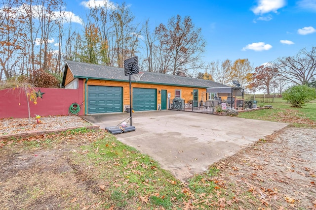 rear view of house featuring a garage