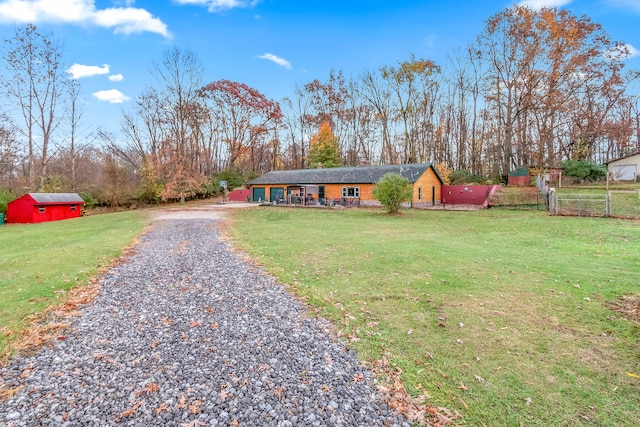 ranch-style house with a front lawn