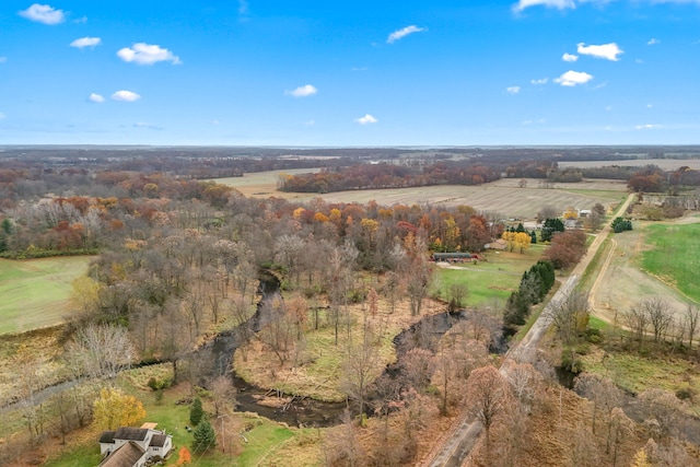 birds eye view of property with a rural view