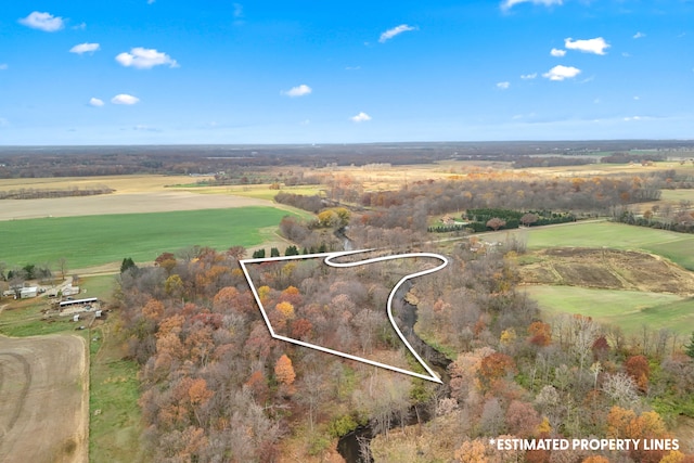 birds eye view of property featuring a rural view