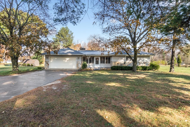 ranch-style house with a front yard and a garage